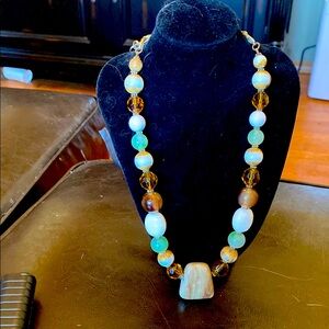 Gold and Brown Necklace with Unique Bead Arrangement